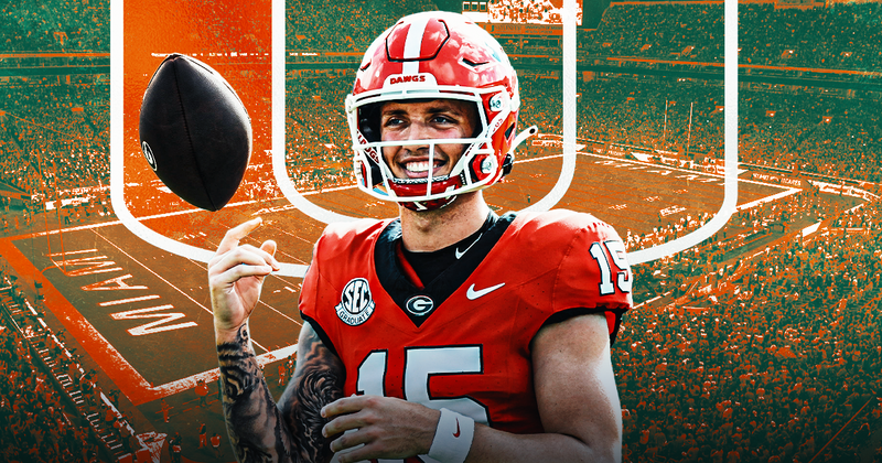 "Georgia Bulldogs QB in red uniform flipping football during a vibrant game day scene at the stadium."