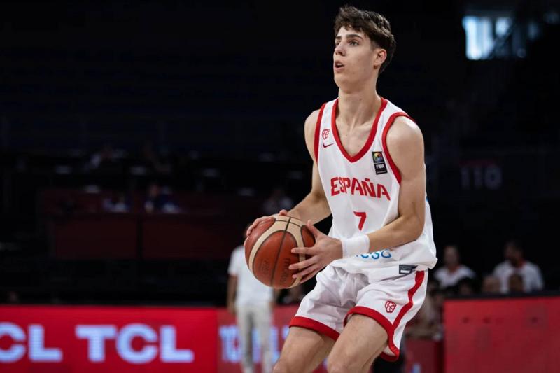 "Spanish basketball player in action, dribbling during an international match, wearing jersey number 7."