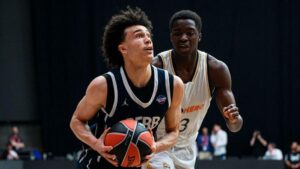 "High school basketball players in intense game action at a national tournament"