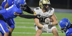 "BMC tight end number 88 dodges tackles during a high school football game"