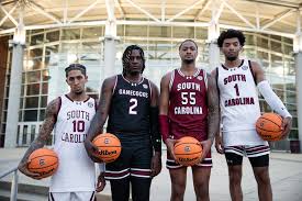 "South Carolina Gamecocks basketball players pose with basketballs during a team photo shoot"