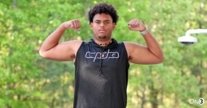 "Tyler Chukuyem flexing in casual attire after his Florida commitment announcement."