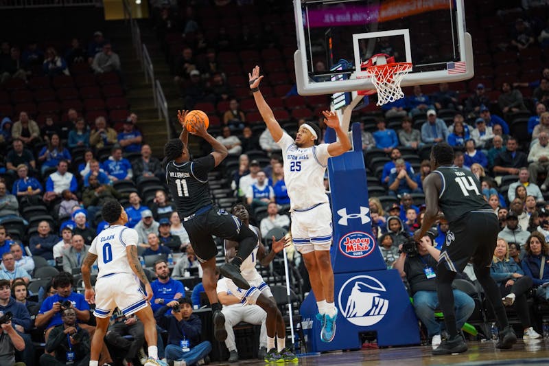 Seton Hall Basketball player Kadary Richmond drives to the basket during college game action